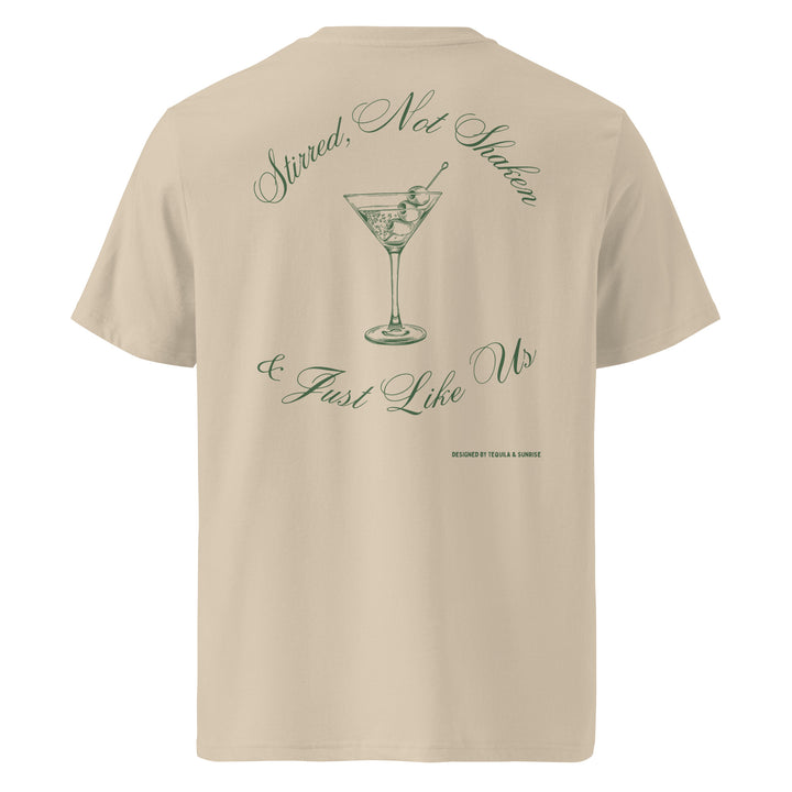 Just Like Us Organic T-shirt featuring a playful cocktail design on a beige background.