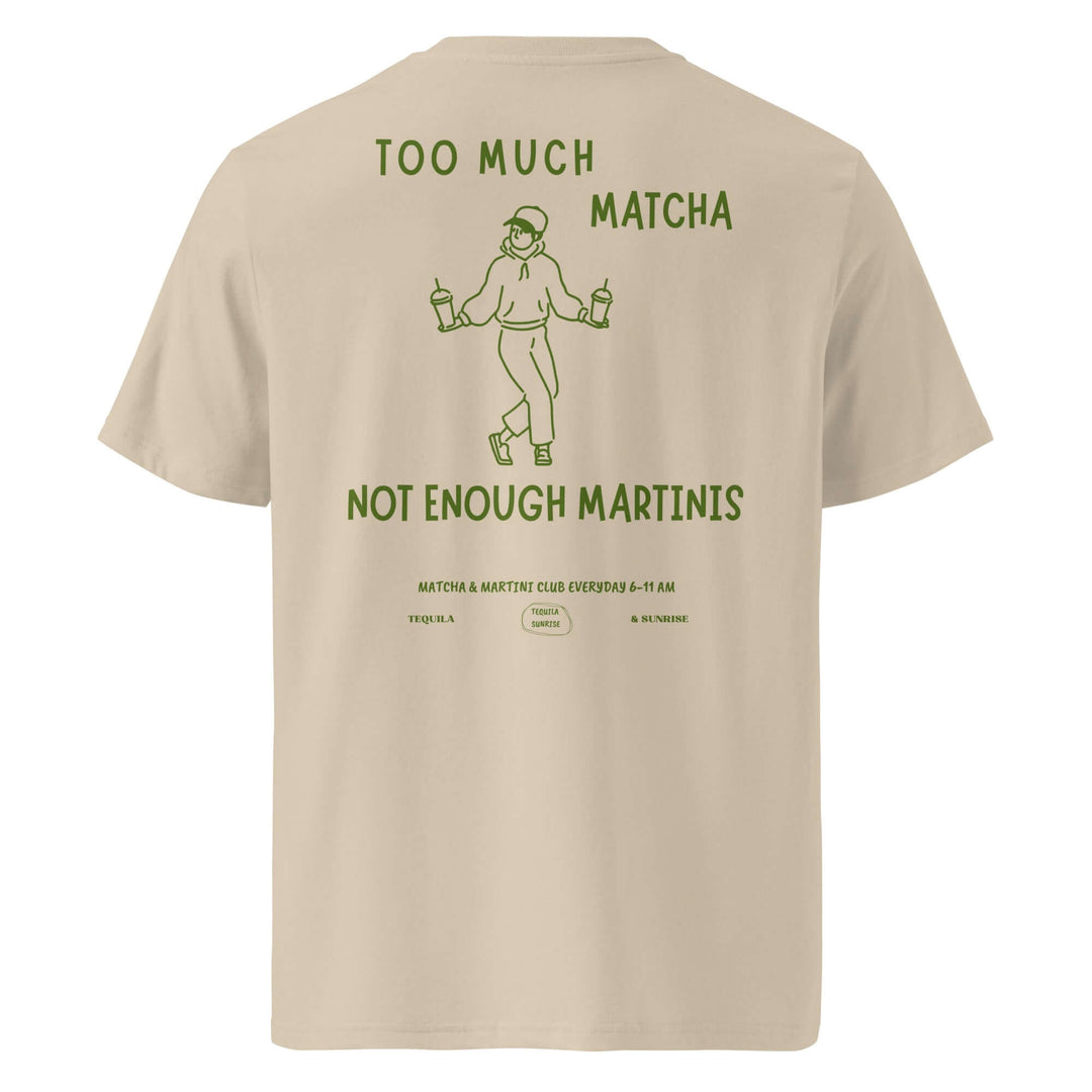 Beige t-shirt with green text and graphic on the back, displayed on a white background.