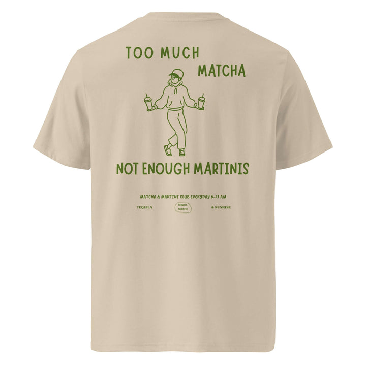 Beige t-shirt with green text and graphic on the back, displayed on a white background.