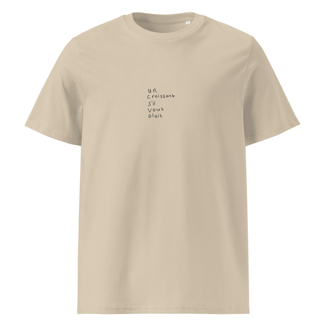 Un Croissant S’il Vous Plait Organic T-shirt in soft beige cotton with minimalist text design.