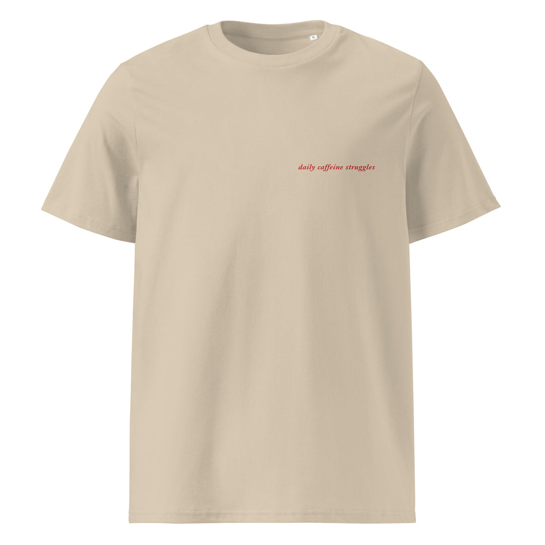Daily Caffeine Struggles Organic T-shirt in beige featuring text on the chest, made from 100% organic cotton.