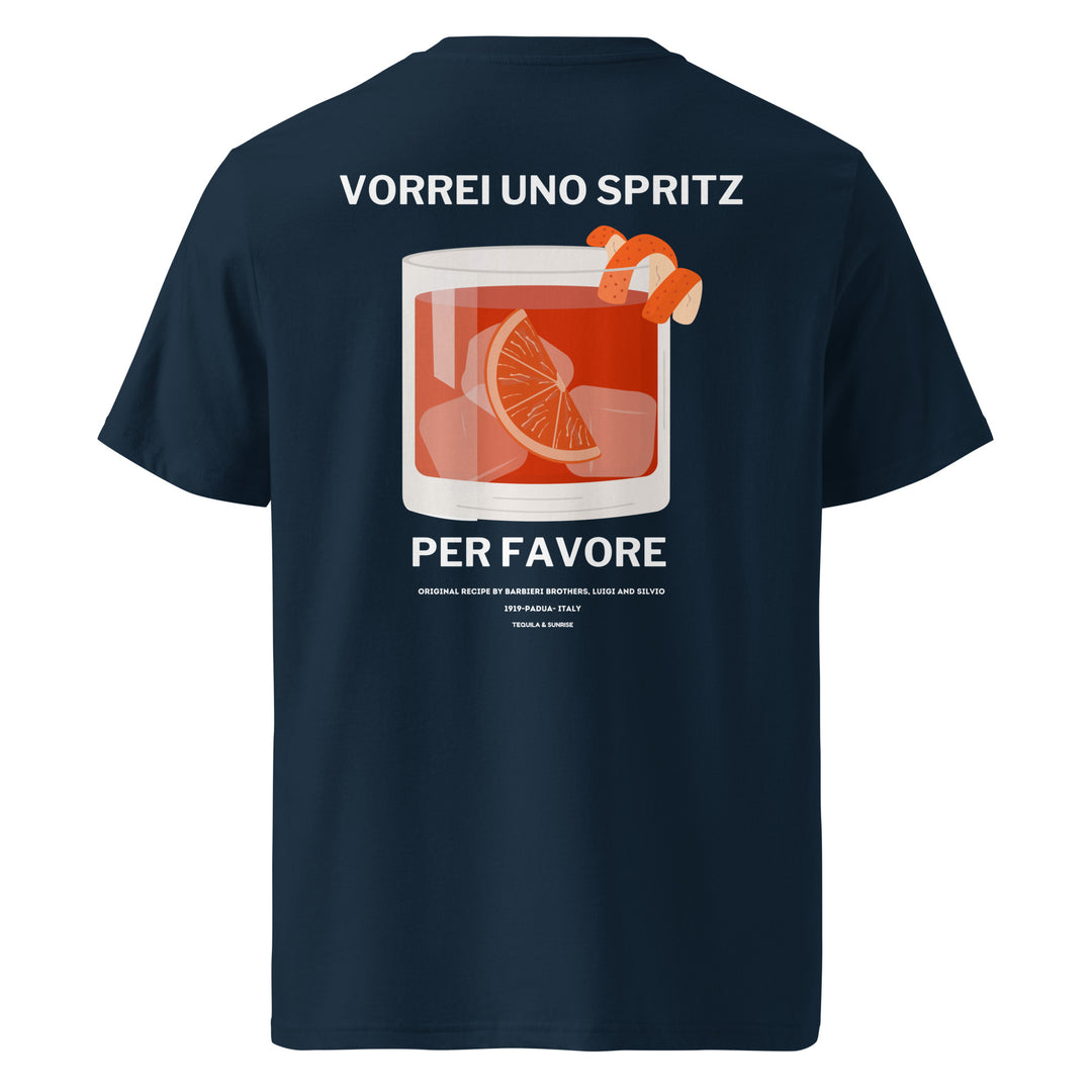 The Tequila & Sunrise Uno Spritz Per Favore Organic Cotton T-shirt, presented in navy blue, features a stylish illustration of a cocktail garnished with orange slices and peel. The bold text "VORREI UNO SPRITZ PER FAVORE" adds a playful element to any wardrobe.