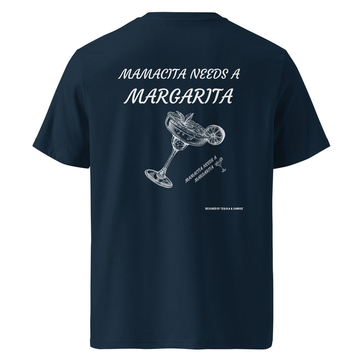 The Mamacita Needs a Margarita Organic T-shirt from Tequila & Sunrise is designed in navy blue using organic cotton. It showcases the phrase "Mamacita needs a margarita" above an elegant illustration of a margarita glass with a lime, making it an ideal choice for those looking for eco-friendly and versatile unisex clothing.