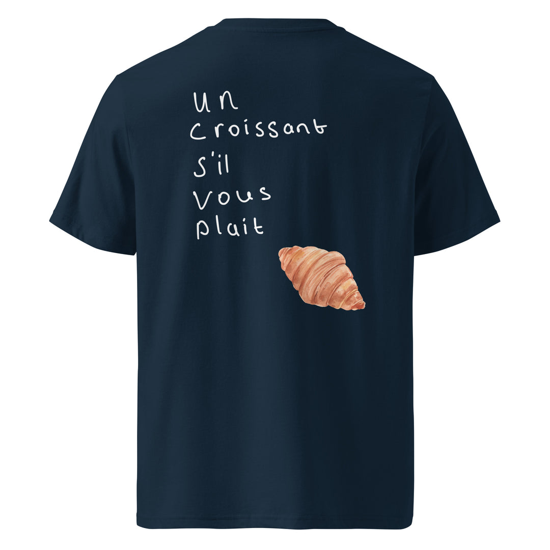 Introducing the Tequila & Sunrise "The Un Croissant S’il Vous Plait Organic T-shirt," a unisex garment crafted from organic cotton. This eco-friendly t-shirt comes in a navy shade, adorned with the phrase "Un croissant s'il vous plaît" and a delightful croissant graphic on the back, offering both comfort and a sprinkle of French charm.