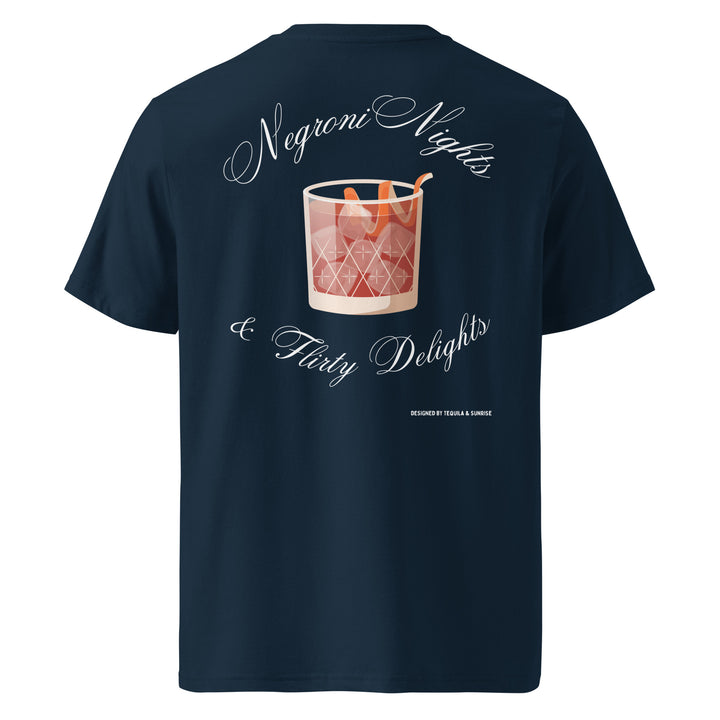 Introducing "The Negroni Nights & Flirty Delights Organic T-shirt" by Tequila & Sunrise, a navy blue unisex t-shirt crafted from eco-friendly organic cotton. It showcases a printed design of a Negroni cocktail glass and the text "Negroni Nights & Flirty Delights" on the back, offering a stylish choice that’s gentle on both you and the planet.