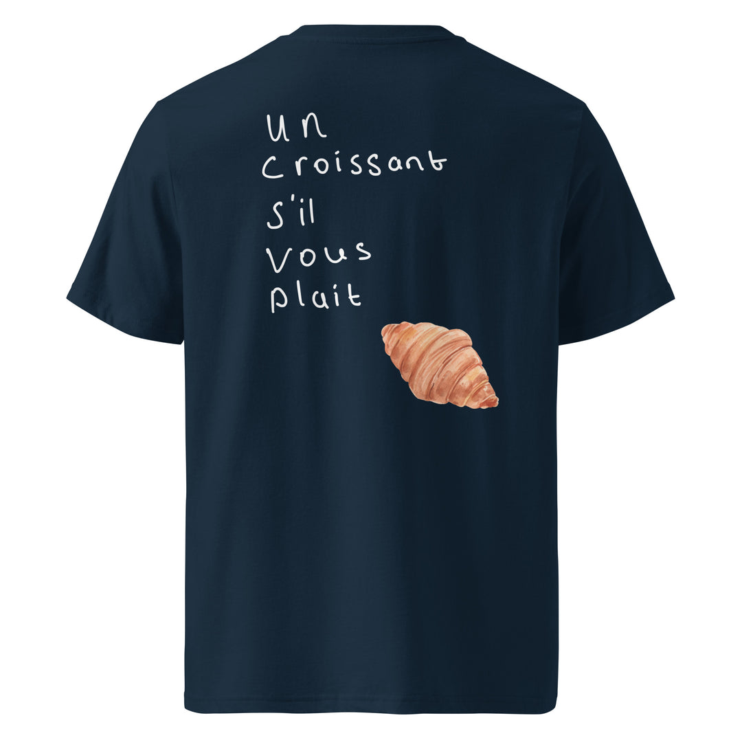 Un Croissant S’il Vous Plait Organic T-shirt with croissant graphic and French text on navy background.