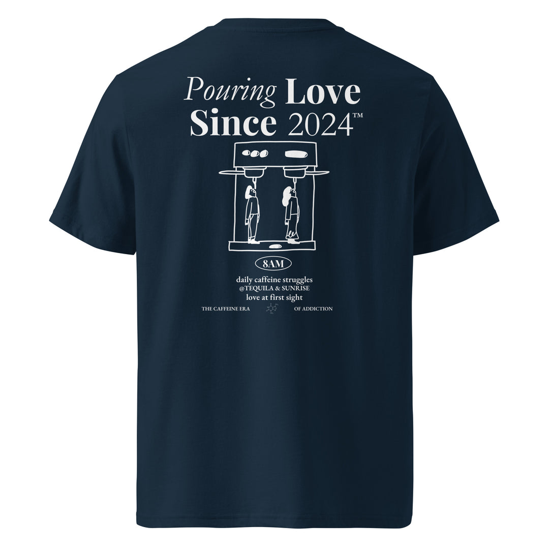 Daily Caffeine Struggles Organic T-shirt featuring a creative design with the slogan 'Pouring Love Since 2024'.