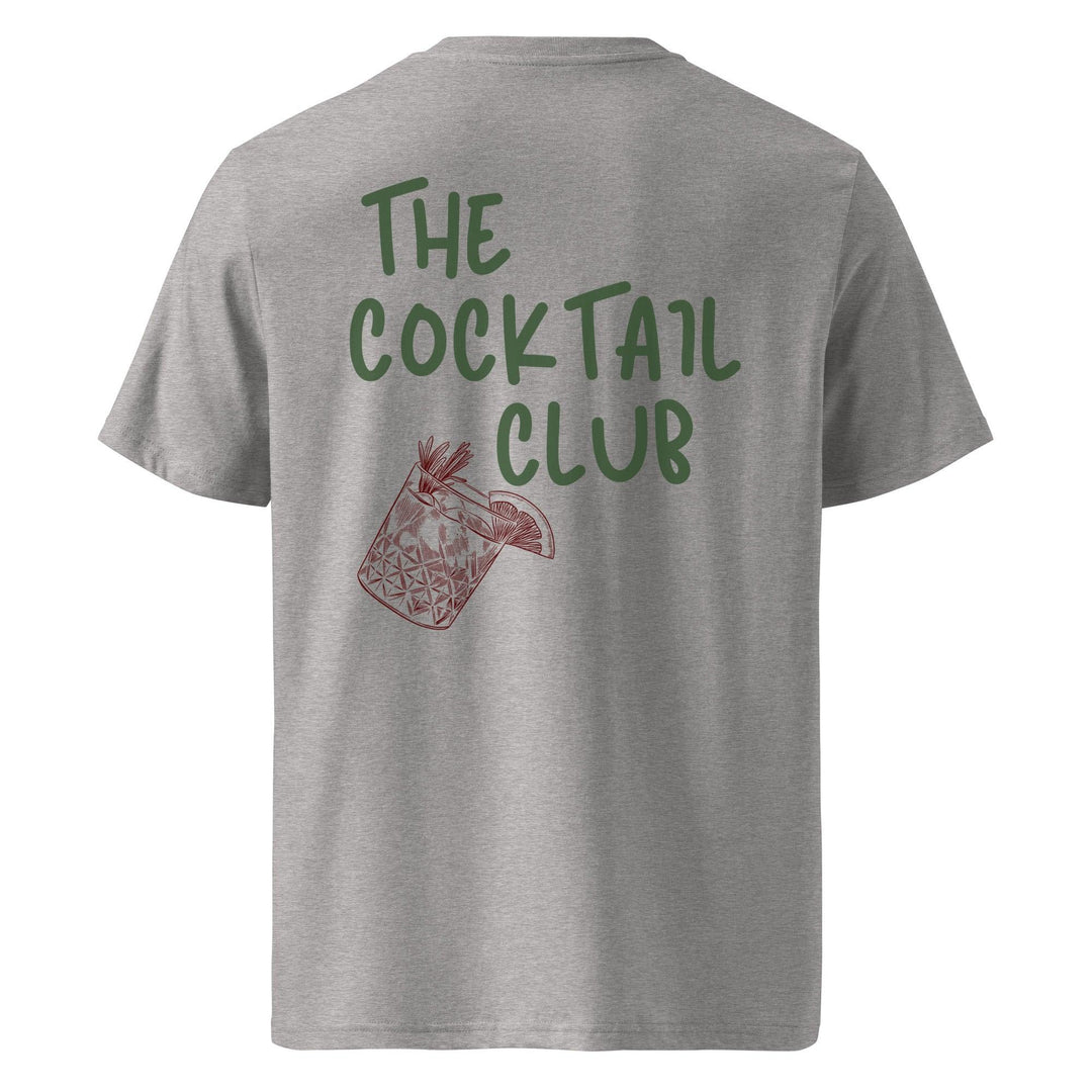 The Cocktail Club Organic T-shirt by Tequila & Sunrise is a gray unisex tee crafted from organic cotton, showcasing "The Cocktail Club" in green on the back above a red cocktail glass illustration with a garnish. Embrace eco-friendly fashion with flair.