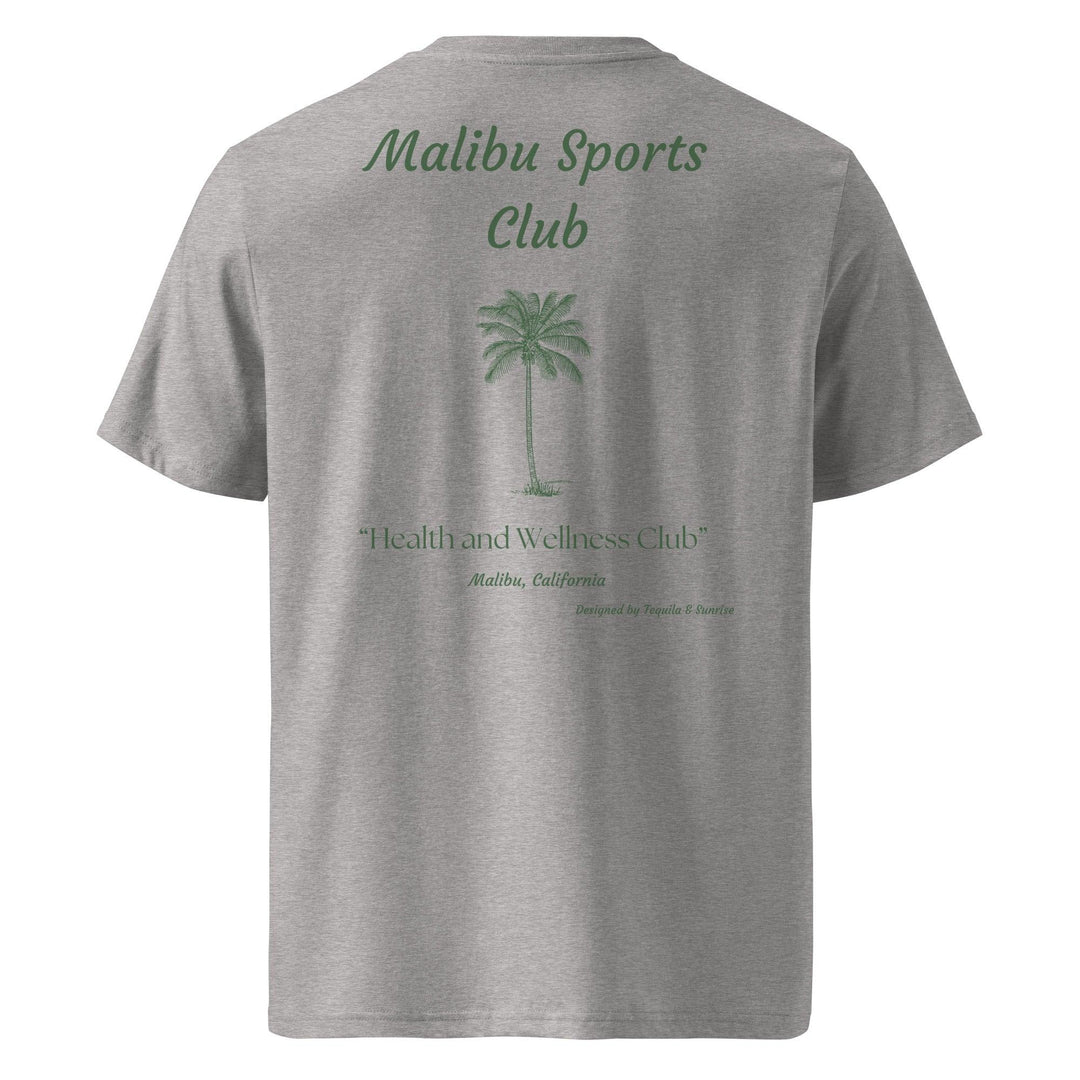 Introducing the Malibu Sports Club Organic T-shirt by Tequila & Sunrise, featuring a gray color with the Malibu Sports Club text and a chic palm tree graphic on the front. Enjoy comfort and quality in this eco-friendly garment, which also elegantly displays 'Malibu Health and Wellness Club' on the back.