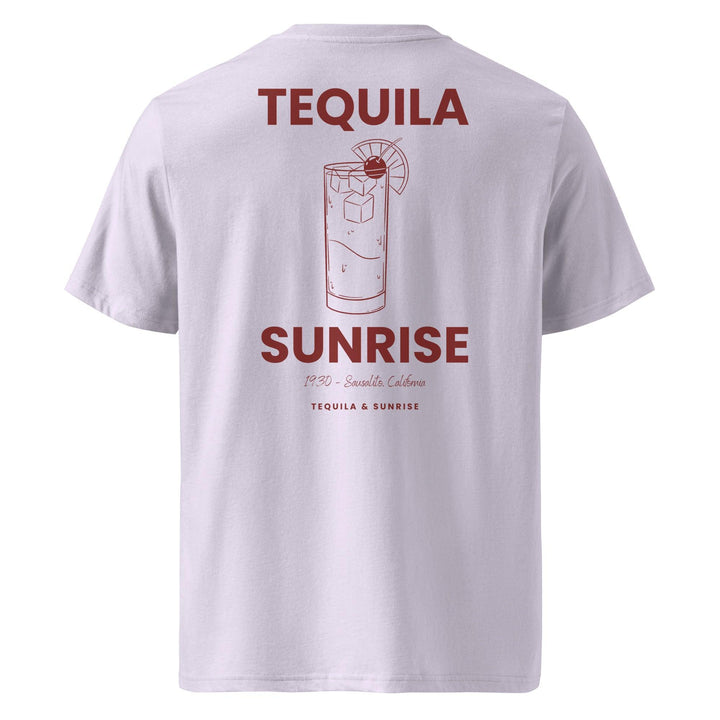 The Tequila & Sunrise Organic T-shirt by the brand Tequila & Sunrise is an eco-friendly white tee showcasing the "Tequila Sunrise" text, complemented by a line drawing of a cocktail glass with a citrus slice. Made from organic cotton, it features "1970 - Sausalito, California" beneath the design, offering a stylish graphic tee with a nostalgic flair.