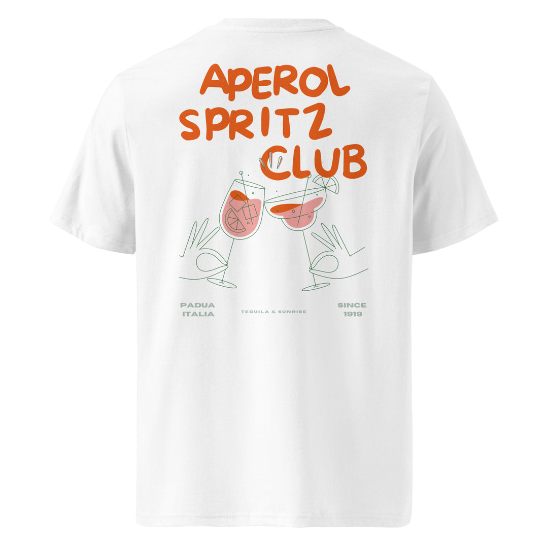 The Aperol Spritz Club Organic T-shirt by Tequila & Sunrise is made from white organic cotton and showcases "Aperol Spritz Club" printed in orange, along with two graphic hands holding glasses. It features the text "Padua Italia," "Tequila Sunrise," and "Since 1919." This eco-friendly design seamlessly blends style with sustainability for a timeless look.