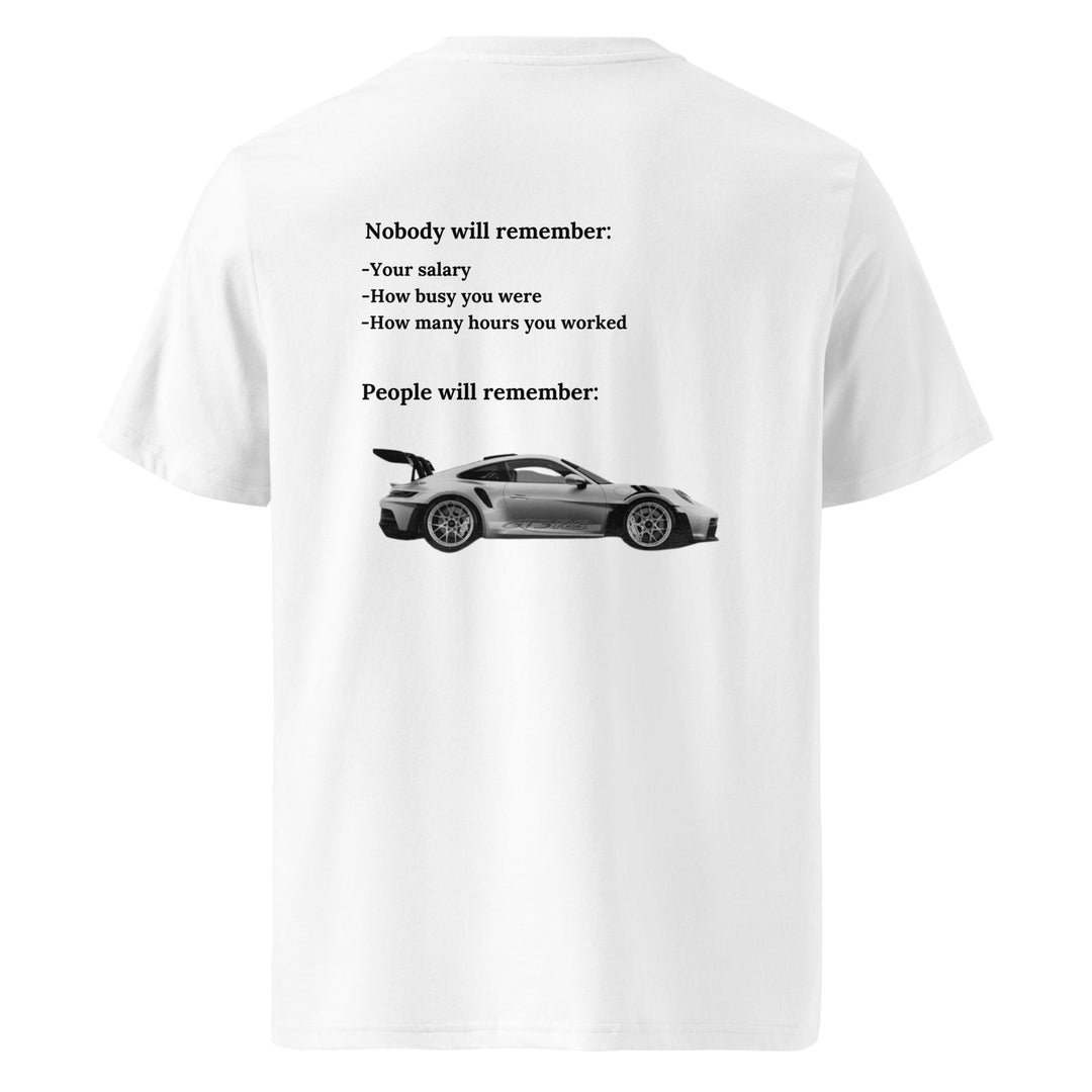 The Porsche Nobody Will Remember You Organic T-shirt by Tequila & Sunrise is a unisex tee showcasing a black and white sports car image with a thought-provoking message: "Nobody will remember your salary, how busy you were, or your work hours." Made from eco-friendly organic cotton, this shirt serves as a reminder of what truly leaves an impression on others.