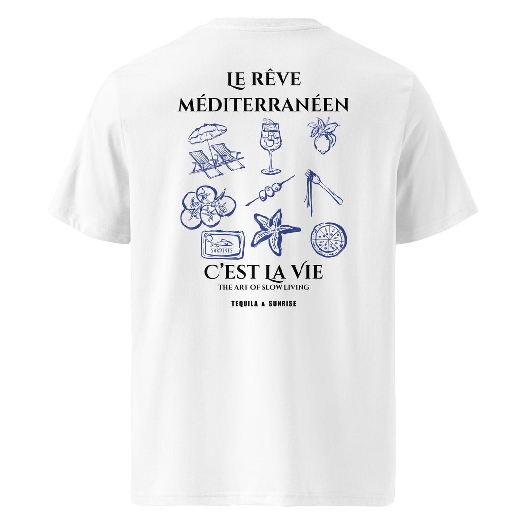 The Mediterranean Dream Organic T-shirt by Tequila & Sunrise showcases blue illustrations of beach items and French text celebrating Mediterranean dreams and the art of slow living, all crafted from soft organic cotton in an eco-friendly design.