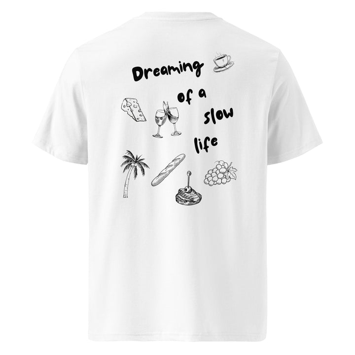 Experience the slow life with Tequila & Sunrise's La Vita Lenta Organic T-shirt. Made from eco-friendly organic cotton, this white t-shirt features the phrase "Dreaming of a slow life" along with charming line drawings of cheese, wine glasses, coffee cups, a palm tree, baguette, cake, and grapes.