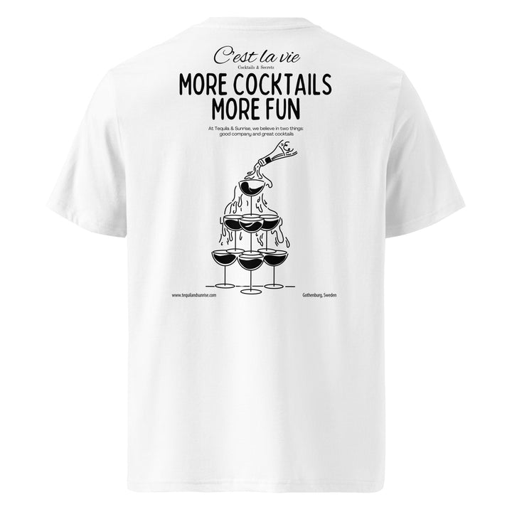 The More Cocktails More Fun Organic T-shirt by Tequila & Sunrise is a unisex, eco-friendly white t-shirt made from organic cotton. It features the playful text "More Cocktails More Fun" alongside an illustration of a cocktail tower being poured over, perfectly blending style and sustainability for any wardrobe.