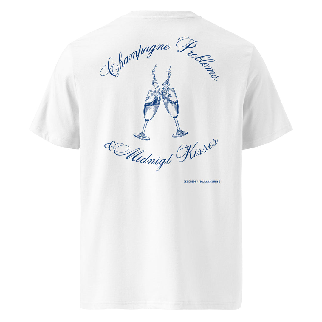 Champagne Problems & Midnight Kisses Organic T-shirt featuring elegant champagne glasses design in blue on a white background.