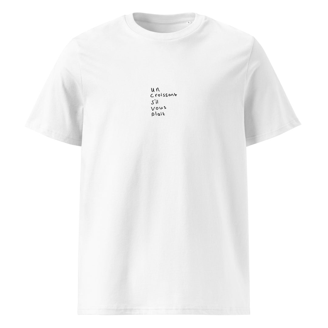 Tequila & Sunrise presents The Un Croissant S'il Vous Plait Organic T-shirt, a white eco-friendly and stylish unisex option crafted from organic cotton and featuring the text "un croissant s'il vous plaît" printed in a small black font on the front.