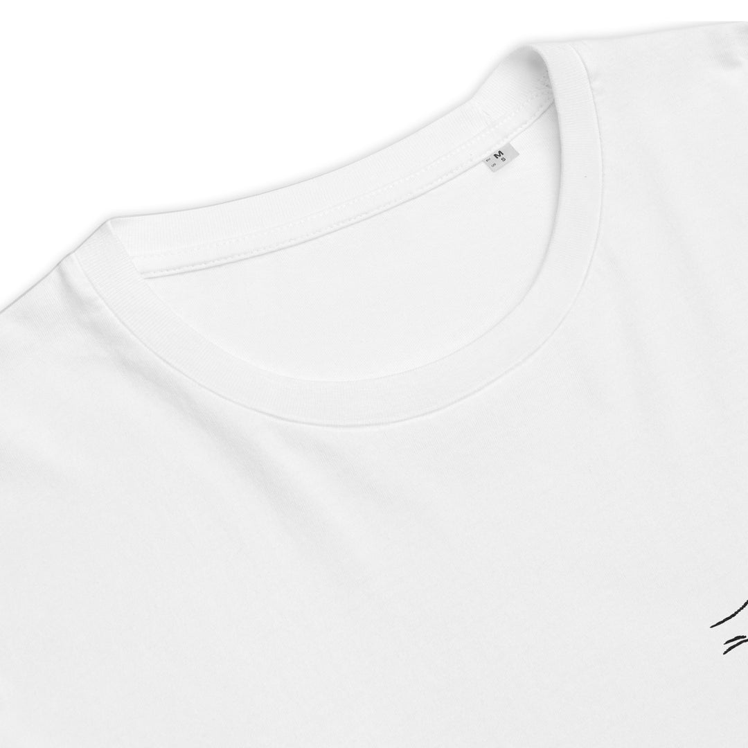 Introducing The La Dolce Vita Organic T-shirt by Tequila & Sunrise: a unisex fashion statement in white, crafted from organic cotton. This tee features a round neck and is accented with a small black design near the hemline.